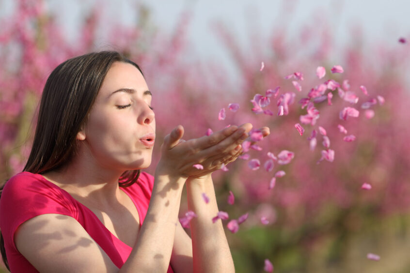 pranayama and breathwork blowing flowers